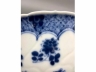 青花雕地折枝花花口碗