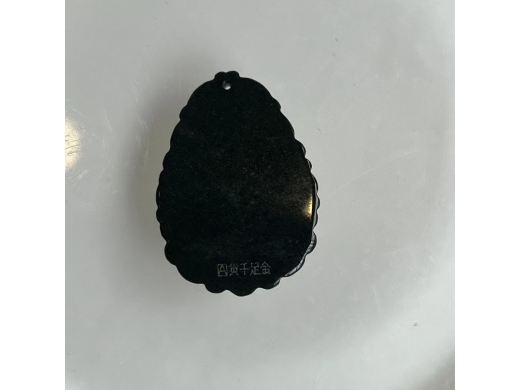 15墨翠金镶玉佛