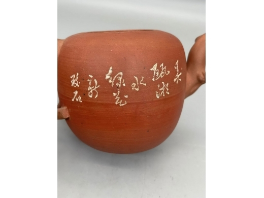 紫砂刻花卉柿蒂壶